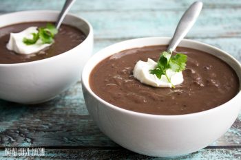 Creamy Slow Cooker Black Bean Soup is a comforting meal topped with sour cream for a dish that's fit for a restaurant!