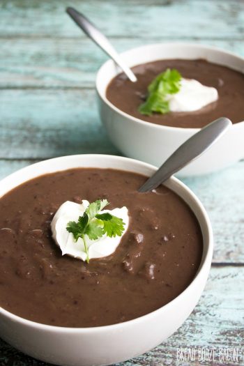 Creamy Slow Cooker Black Bean Soup is a comforting meal topped with sour cream for a dish that's fit for a restaurant!