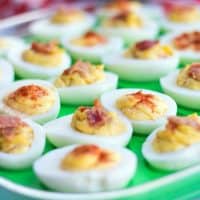 Bacon + Roasted Garlic Deviled Eggs are addictive little bites of summer BBQ happiness!