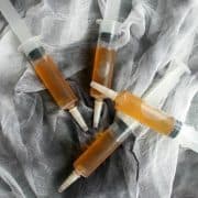 Poison Apple Jello Shot Syringes are perfect for you Halloween party. Mulled apple cider and whiskey are a killer fall cocktail!