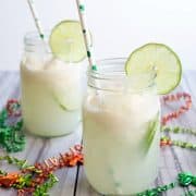 Forget creamsicles! Spiked Lime Ice Cream Soda is where it's at for a refreshing, citrusy cocktail! It's perfect for St. Patrick's Day or a warm day!