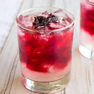 Our Spiked Hibiscus Lemonade everything I love about serving a cocktail to guests. It's simple, delicious & absolutely gorgeous!