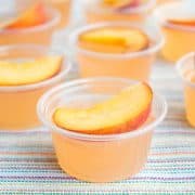 Peach Fizz Jello Shots are about to become your go-to summer cocktail! Super easy to make and crazy good, these shots disappear in a flash!