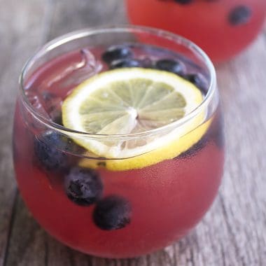 Day drinking is totally acceptable when it's Spiked Blackberry Lemonade Punch! This cocktail screams summer and is the perfect drink for your next cookout!
