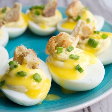 Deviled Eggs Benedict are a cross between two of my most beloved bites! They are super easy to make and disappear as fast as you can make them!