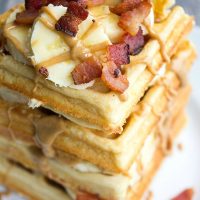 These Elvis Waffles are a towering stack of peanut butter, banana, and bacon goodness not even the king himself could resist!