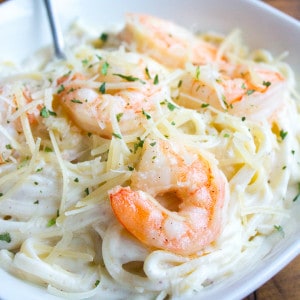 Get dinner on the table in about 15 minutes with this Easy Shrimp Alfredo recipe that'll rival any restaurant!