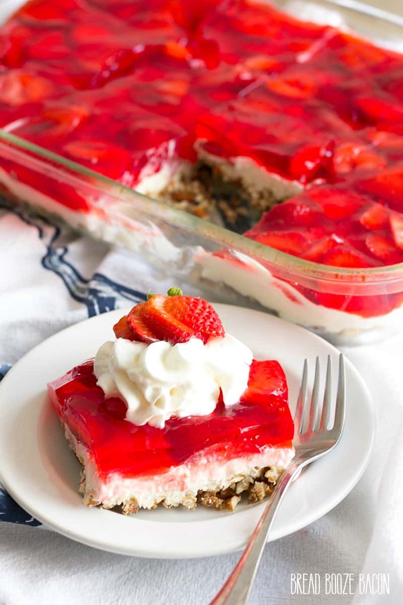 Strawberry Pretzel Salad is an easy dessert that's a party favorite! Layers of crunchy pretzels, luscious cream cheese mousse, and strawberries with jello are the best summer treat!