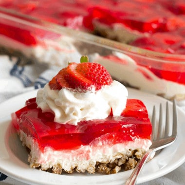 Strawberry Pretzel Salad is an easy dessert that's a party favorite! Layers of crunchy pretzels, luscious cream cheese mousse, and strawberries with jello are the best summer treat!