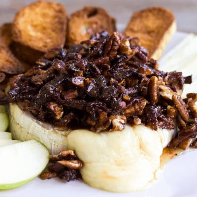 Ooey, gooey Bacon Pecan Baked Brie is the best bite for any occasion! Baking spices, salty bacon, nuts, and tangy brie are a match made in flavor heaven!