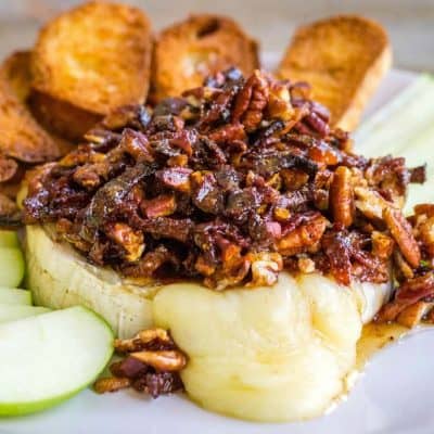 Ooey, gooey Baked Brie with Pecans and Bacon is the best bite for any occasion! Baking spices, salty bacon, nuts, and tangy brie are a match made in flavor heaven!