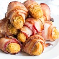 One bite of these Crab and Bacon Rolls and you'll be hooked! This easy party appetizer is like a crab cake wrapped in bacon and everyone loves it!