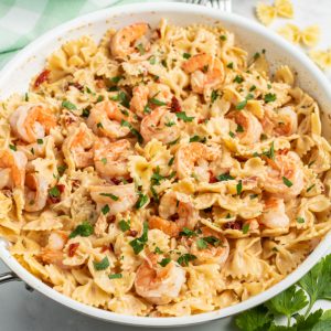 Sun-Dried Tomato & Balsamic Shrimp Pasta is a 15-minute dinner you'll crave! A creamy, tangy sauce pairs perfectly with sweet shrimp & savory tomatoes!