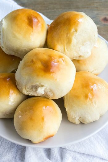 These slightly sweet and oh so fluffy 40-Minute Milk and Honey Dinner Rolls are perfect for weeknights or holiday dinners. So easy to make, they're a must-have recipe for any home cook!