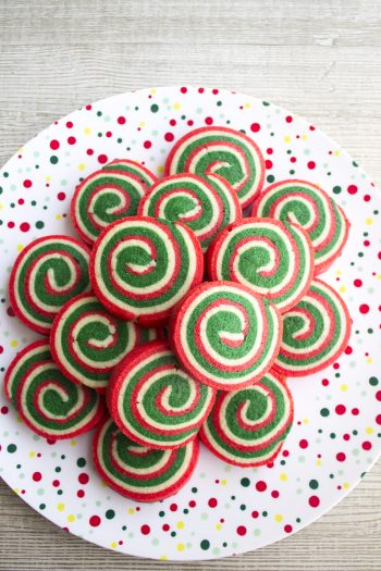 These Christmas Pinwheel Cookies are sure to be the star of your holiday cookie plates! Bring them to a cookie swap and watch everyone's eye light up!