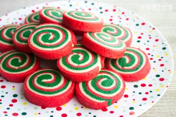 These Christmas Pinwheel Cookies are sure to be the star of your holiday cookie plates! Bring them to a cookie swap and watch everyone's eye light up!