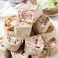 Ranch BLT Roll Ups stacked up on a plate