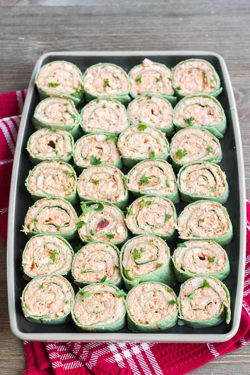 Chicken Parmesan Roll Ups are any easy appetizer loaded with your favorite Italian flavors! These poppable pinwheels are guaranteed to fly off the plate at your next party!