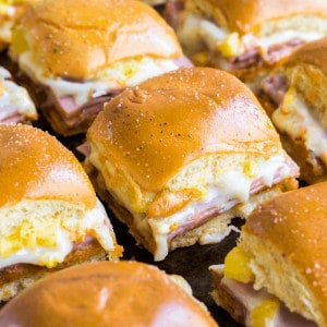 Your party isn't complete until you serve up these Hawaiian Pizza Sliders! Loaded with all your favorite pizza toppings, these sliders are easy to make and always a crowd favorite!