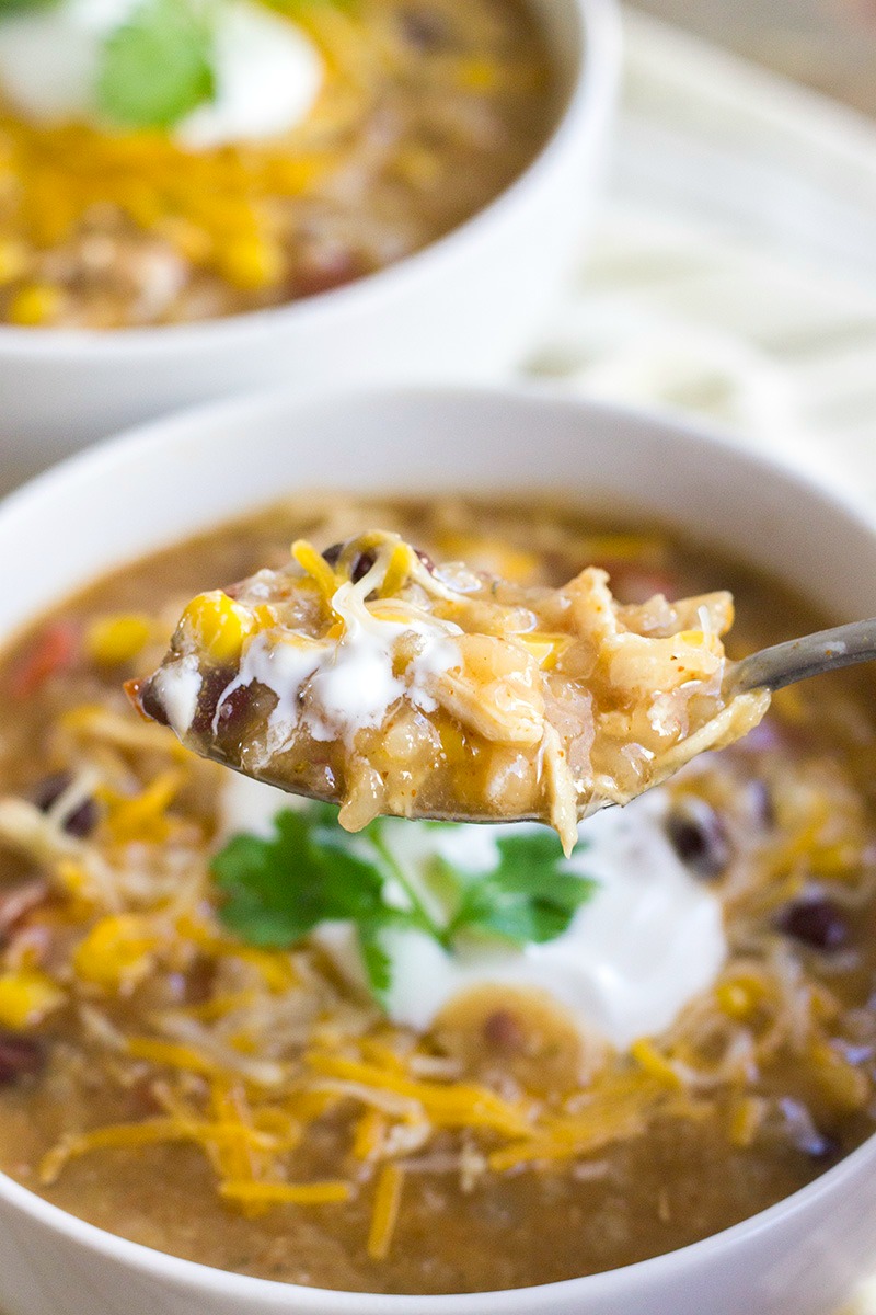 The southwestern flavors in this Instant Pot Mexican Chicken and Rice Soup will satisfy your soul! Comforting and delicious, this easy soup is a must make!!