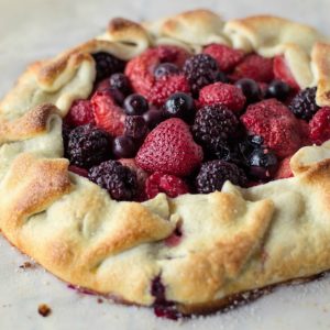 Rustic Berry Tart is a great way to use seasonal berries! You can make your own pie crust from scratch or keep it simple with a pre-made crust from the store!