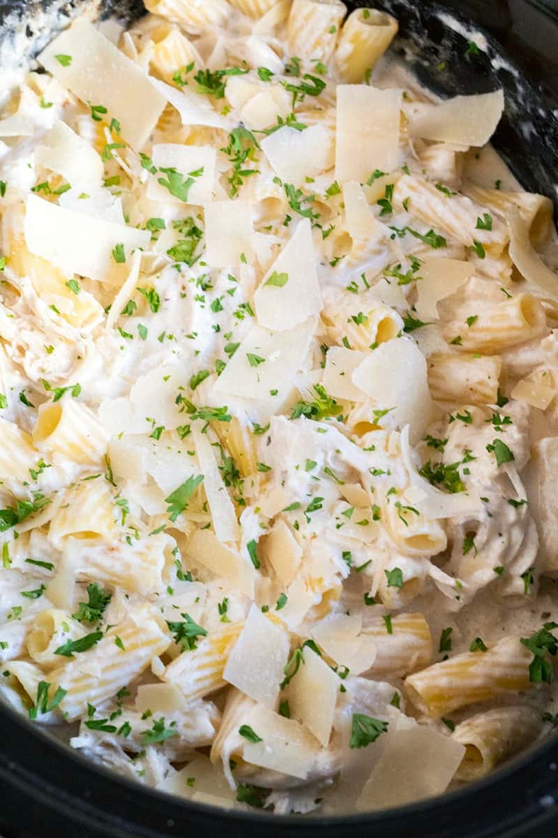 Crock Pot Chicken Alfredo topped with parsley and parmesan