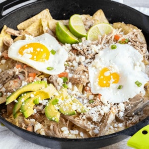 Start your morning off with a skillet of my Pork Chilaquiles Recipe! It's a savory nacho style dish that's satisfying, full of flavor & great for breakfast!