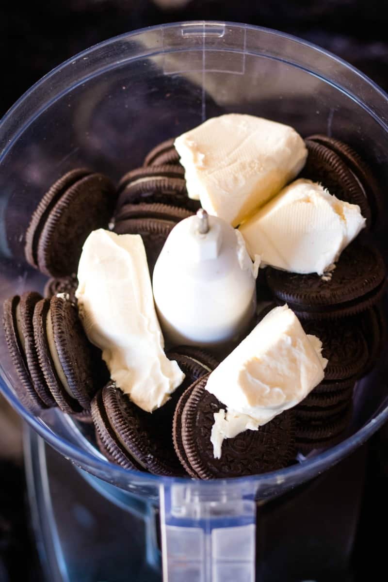 oreo cookies and cream cheese in a food processor