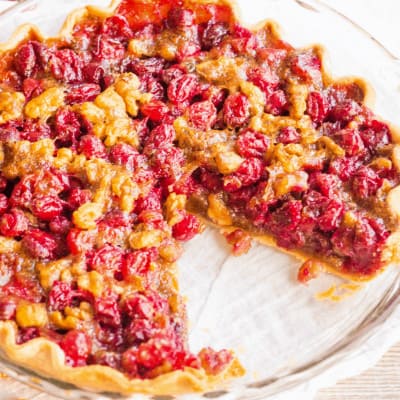 Cranberry Pie is a beautiful dessert that's crazy easy to make! The combination of tart cranberries and savory walnuts is perfect for the holidays!