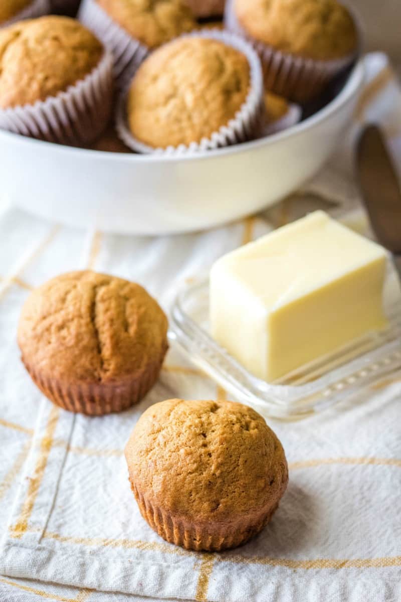 banana bread muffins next to a butter dish