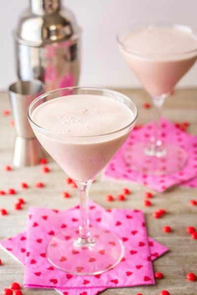 chocolate red hot martini in martini glass with shaker and jigger