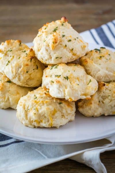 copycat cheddar bay biscuits piled up on a plate