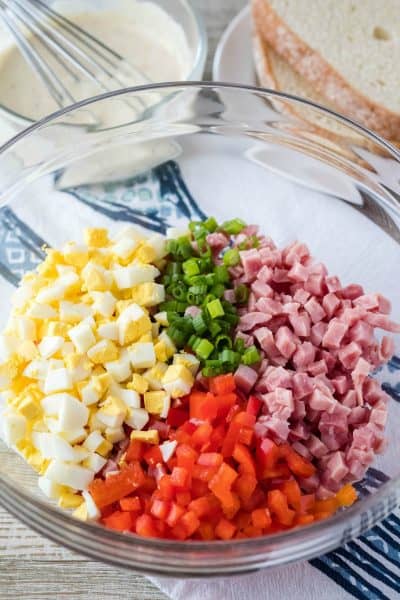ingredients to make ham salad in a mixing bowl