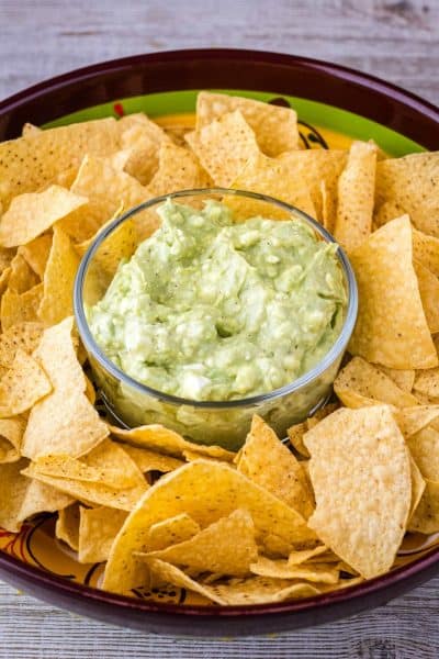 guacamole dip in a bowl with chips