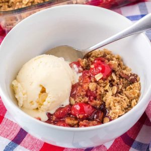 You need this Easy Cherry Crisp recipe in your life! Only 3 steps to dessert bliss! Add a scoop of vanilla ice cream for the ultimate summer treat!