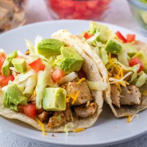 Easy Seasoned Chicken Tacos are ready in 20 minutes. Perfect for busy weeknights! Top them any way you like and watch everyone clean their plates!