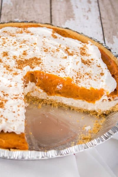 cream cheese pumpkin pie with slices taken out to show center