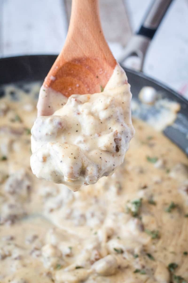close up of sausage gravy on a spoon