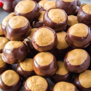 This Buckeye Recipe is a tradition in our house every November. Peanut butter balls are dipped on chocolate to look like a Buckey nut & they’re O-H so good!