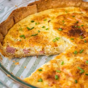 Brunch is a snap when you make this Easy Ham and Cheese Quiche! Simply prep your pie crust, pour in the filling and bake. It's practically fool-proof!