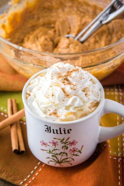 mug of pumpkin chai hot buttered rum with whipped cream