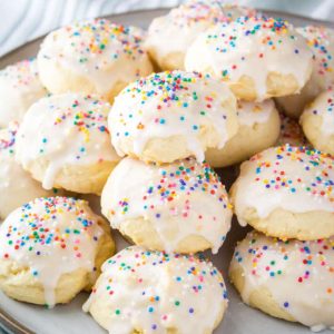 Fluffy and oh so tasty, this Italian Ricotta Cookies Recipe is one you'll treasure for years! Topped with vanilla glaze, these cookies just beg to be eaten!