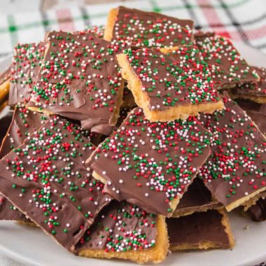 Christmas Crack takes just minutes to make and is completely addicting! Add it to your holiday dessert plates and watch everyone's eyes light up!