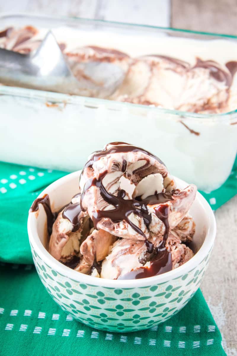 scoops of irish cream ice cream topped with chocolate sauce