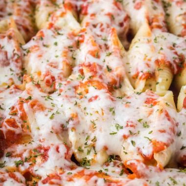 Cheesy Chicken Stuffed Shells are a comforting dinner your family will absolutely devour! Make a big batch and freeze half for later or prep ahead of time and cook later. These shells are so easy, you'll find yourself putting them in regular rotation!