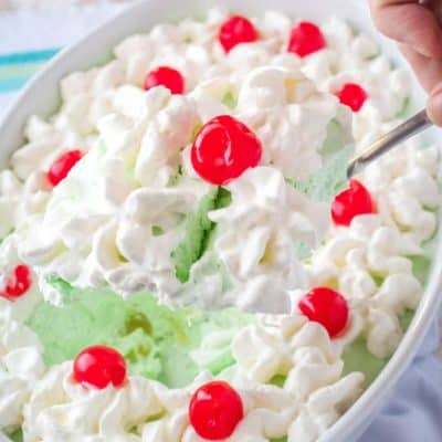 When it comes to potlucks, nothing beats Classic Lime Jello Salad for an easy to make side dish. While we call it a "salad" it's really dessert in disguise!
