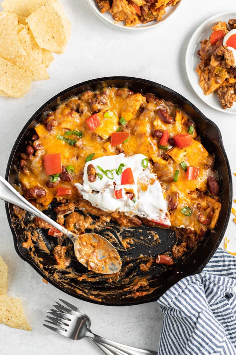 half of a burrito skillet with a spoon