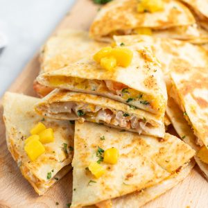 Mango & Shrimp Quesadillas are crazy good and fly off the plate! Make them with or without cilantro for a dinner win the whole family will love!
