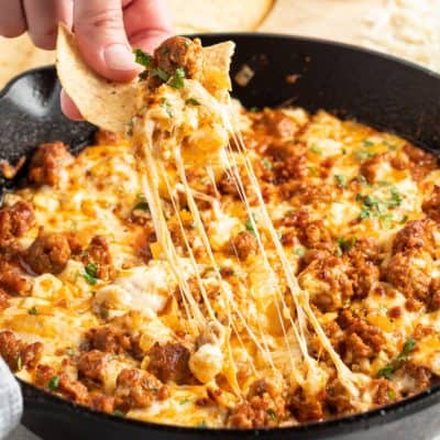 Take a trip to cheese town with this awesome Queso Fundido con Chorizo! This spicy, savory combination is everything you love about cheese dips!