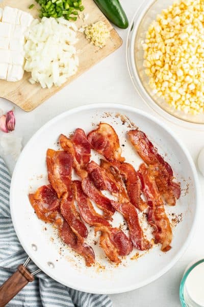 bacon strips cooked crispy in a skillet